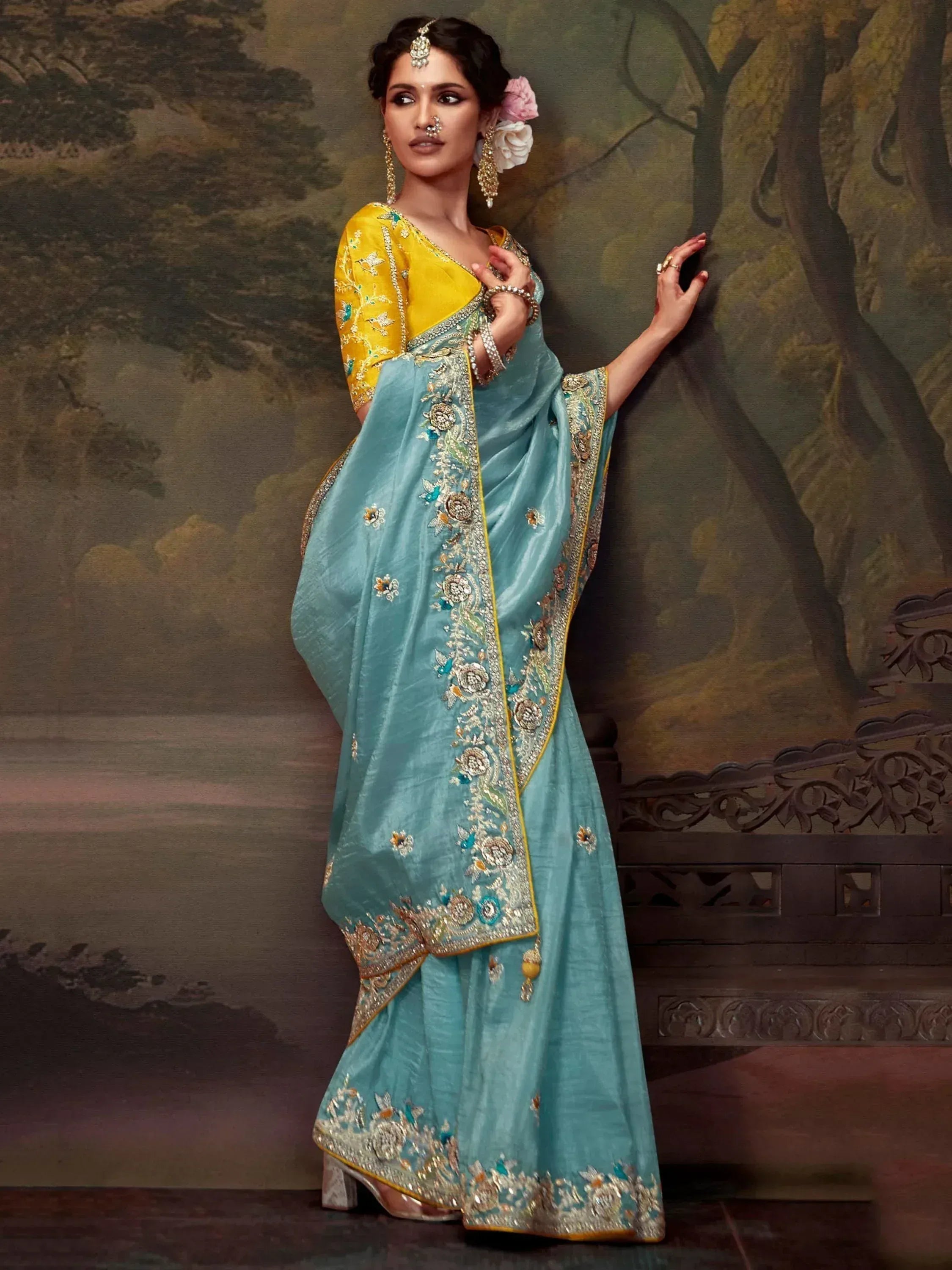 Elegant turquoise saree with gold embroidery and yellow blouse, perfect for Indian ethnic occasions