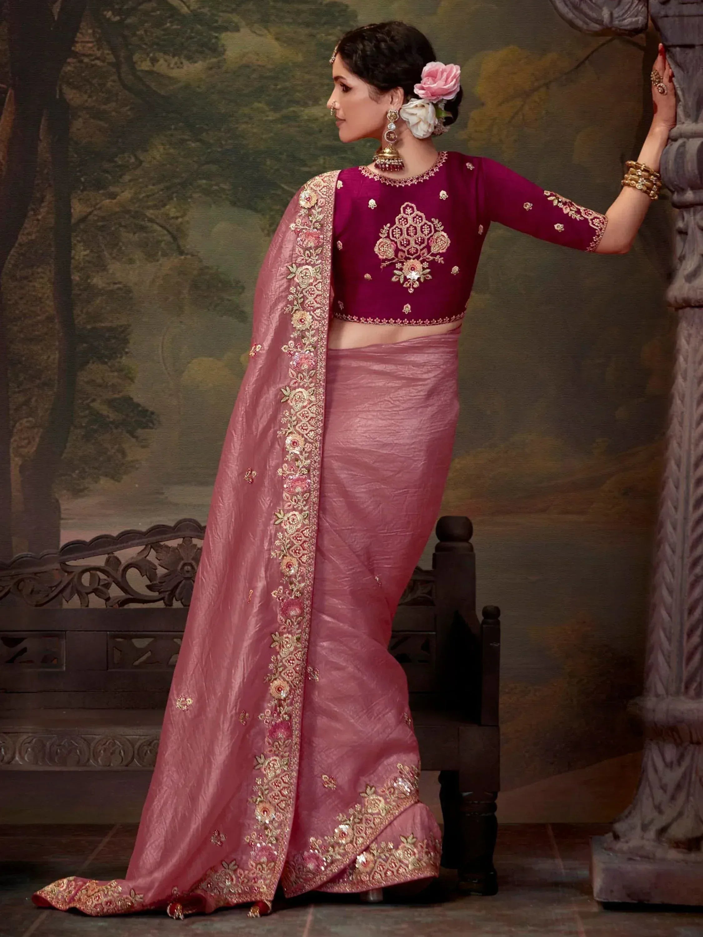 Elegant pink saree with gold embroidery, paired with a maroon blouse, perfect for Indian ethnic occasions.