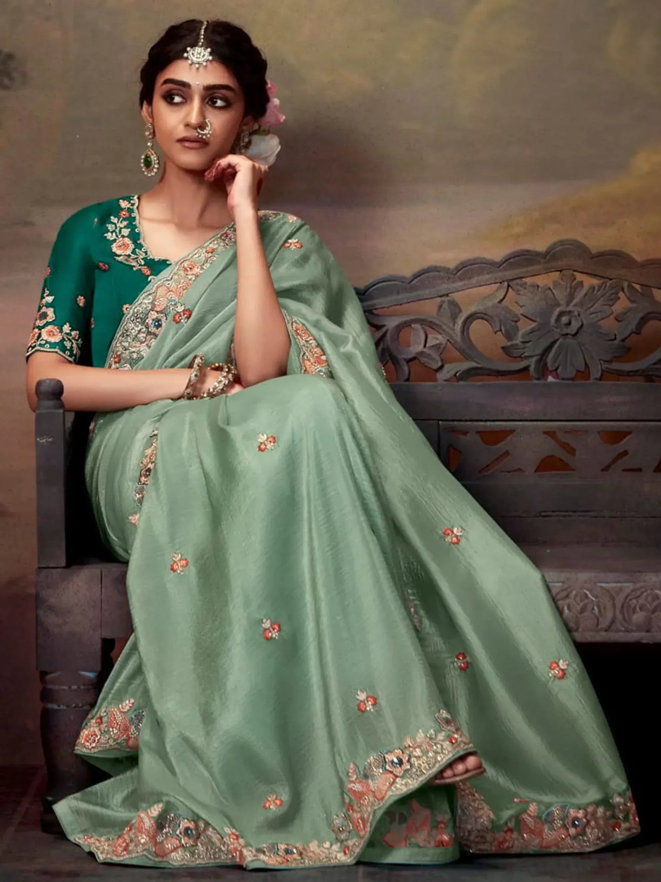 Elegant green embroidered saree with floral detailing, perfect for Indian ethnic occasions