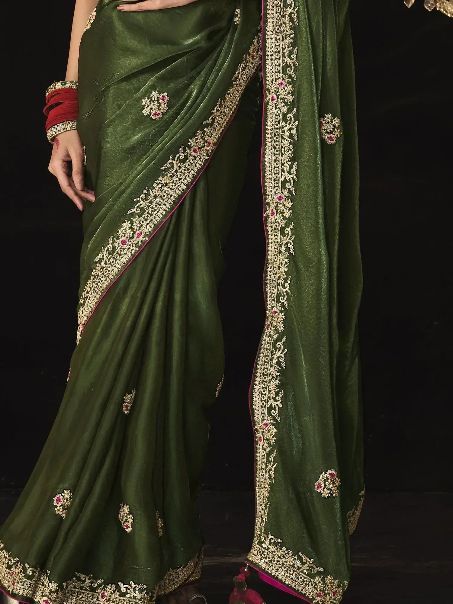 Emerald green silk saree with gold and pink embroidery, perfect for Indian ethnic wear occasions
