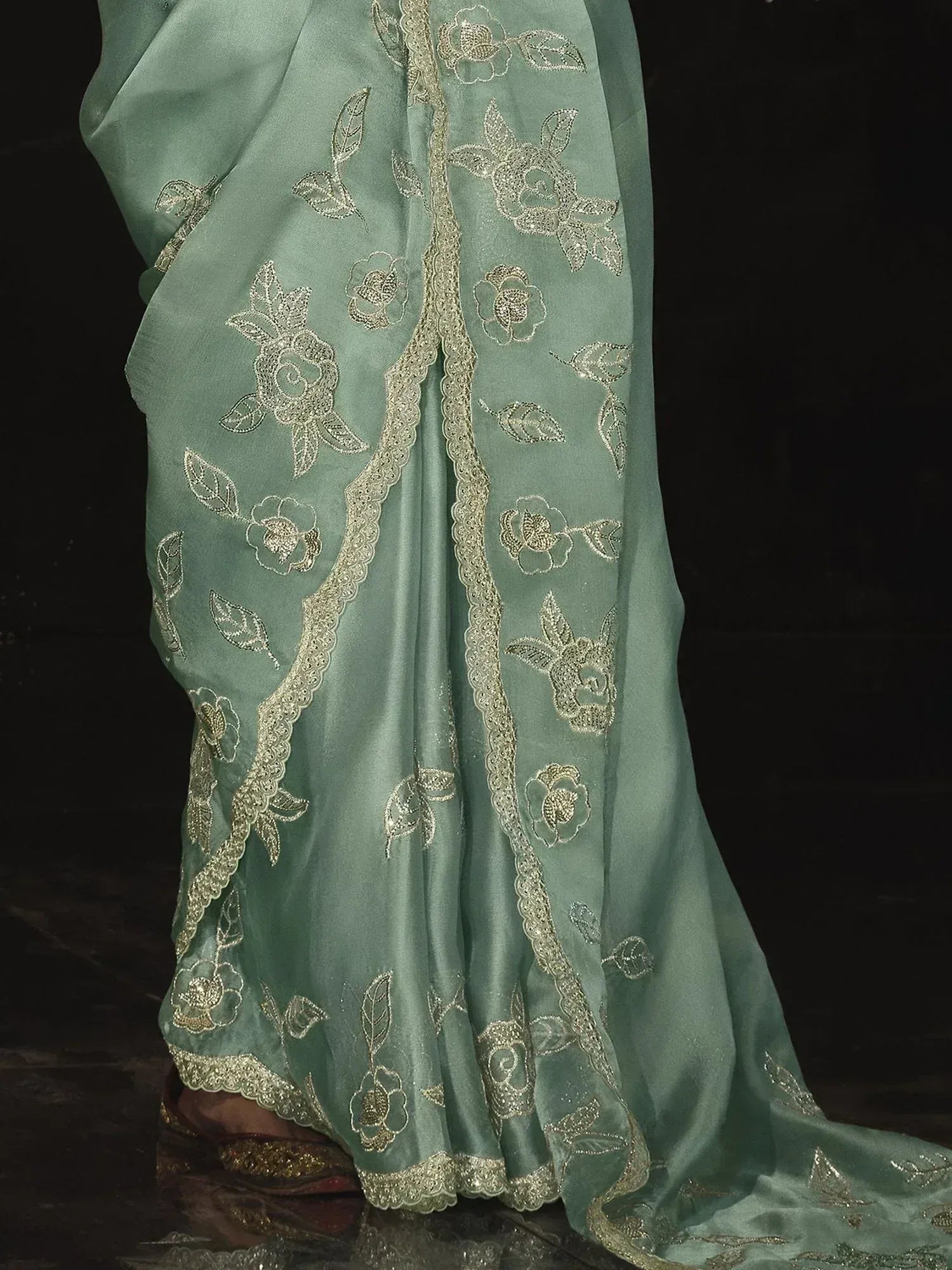 Mint green saree with gold floral embroidery and scalloped border, elegant Indian ethnic wear