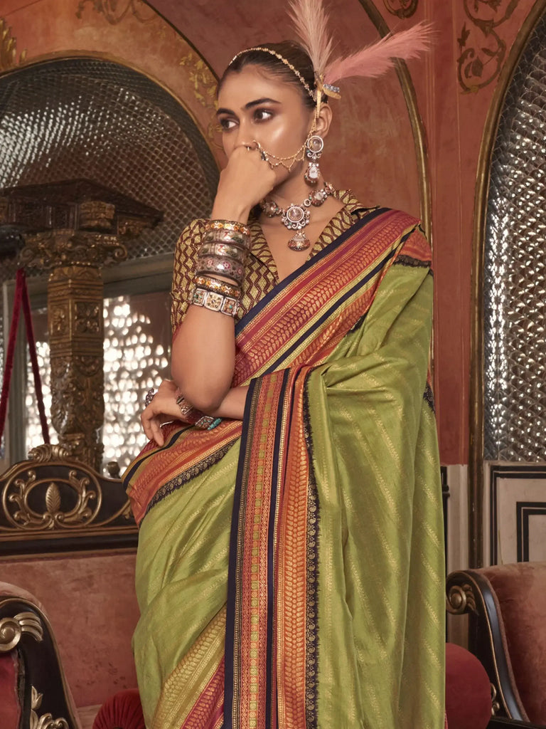 Stunning Olive Green Zari Weaving Silk Function Wear Saree With Blouse