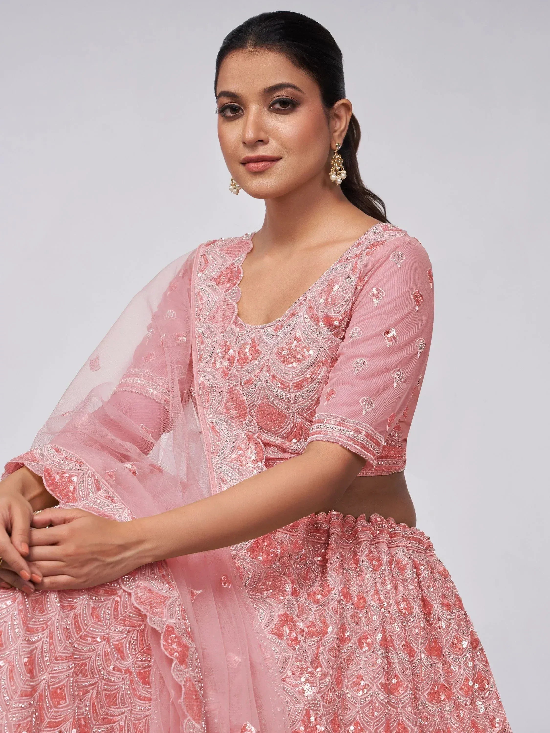 Pink embroidered lehenga choli with sequins and sheer dupatta, perfect for Indian ethnic wear occasions