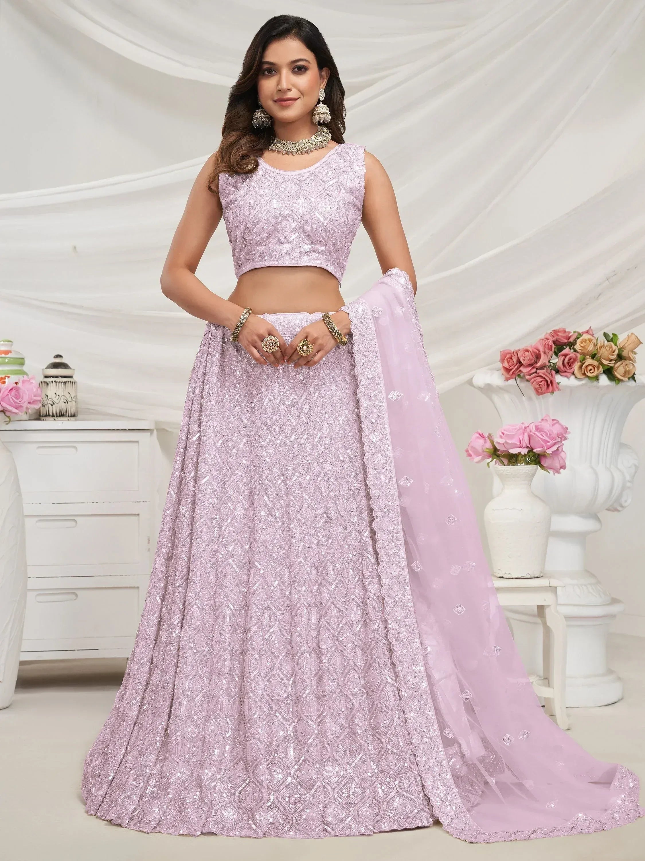 Elegant lavender lehenga choli with intricate embroidery and sequins, perfect for Indian ethnic wear.