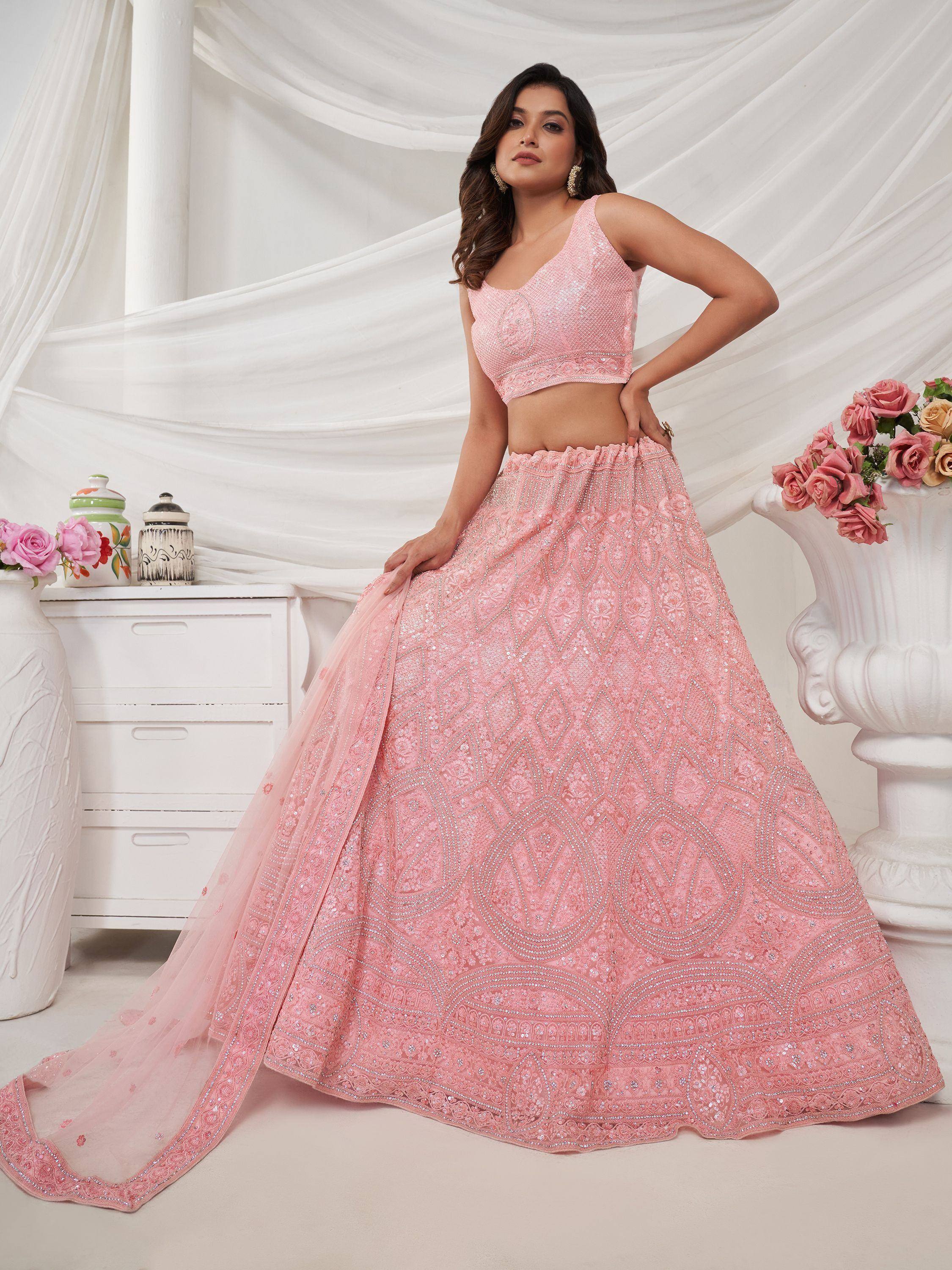 Pink sequin lehenga choli with intricate embroidery, perfect for weddings and festive occasions.