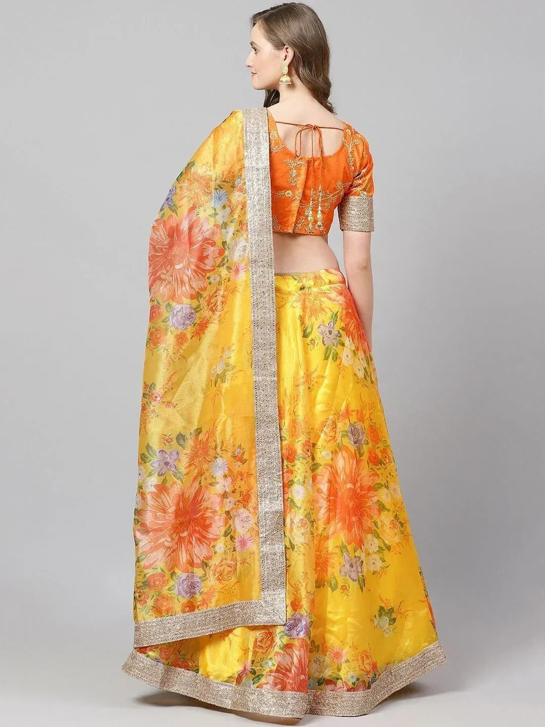 Yellow floral lehenga choli with orange blouse, perfect for Indian ethnic wear occasions