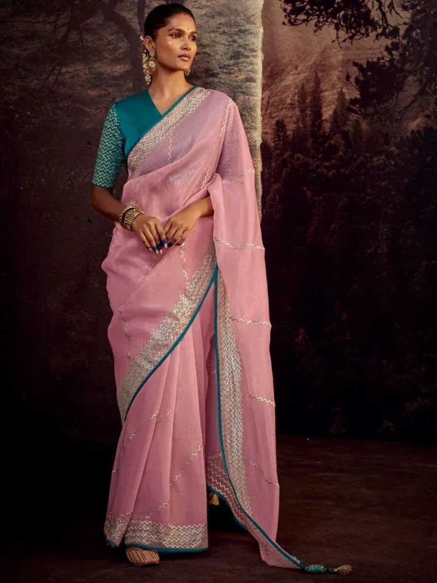 Pink saree with teal blouse and silver zari border, elegant ethnic wear for women