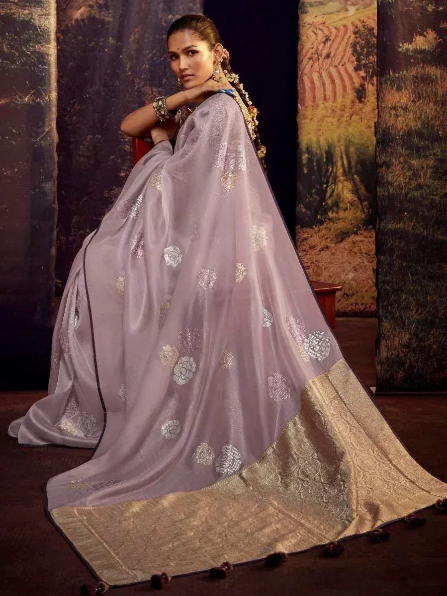 Elegant lavender saree with gold floral embroidery and woven border, perfect for Indian ethnic occasions