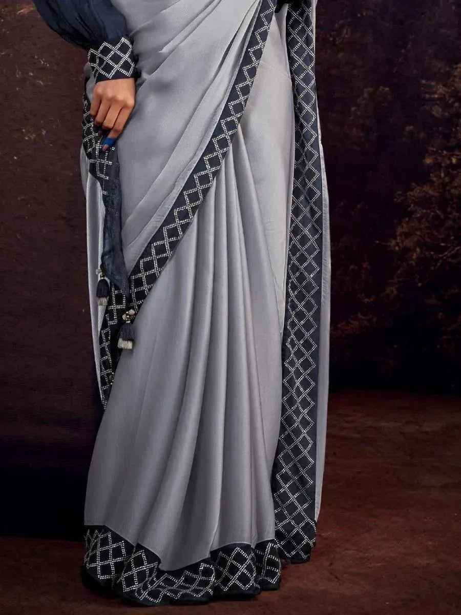 Grey saree with black geometric border and tassels, Indian ethnic wear