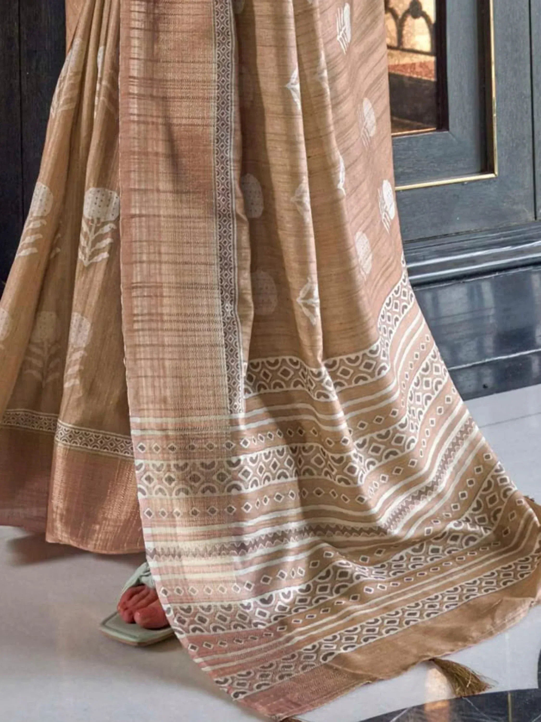 Beige printed ethnic saree with geometric border, traditional Indian wear