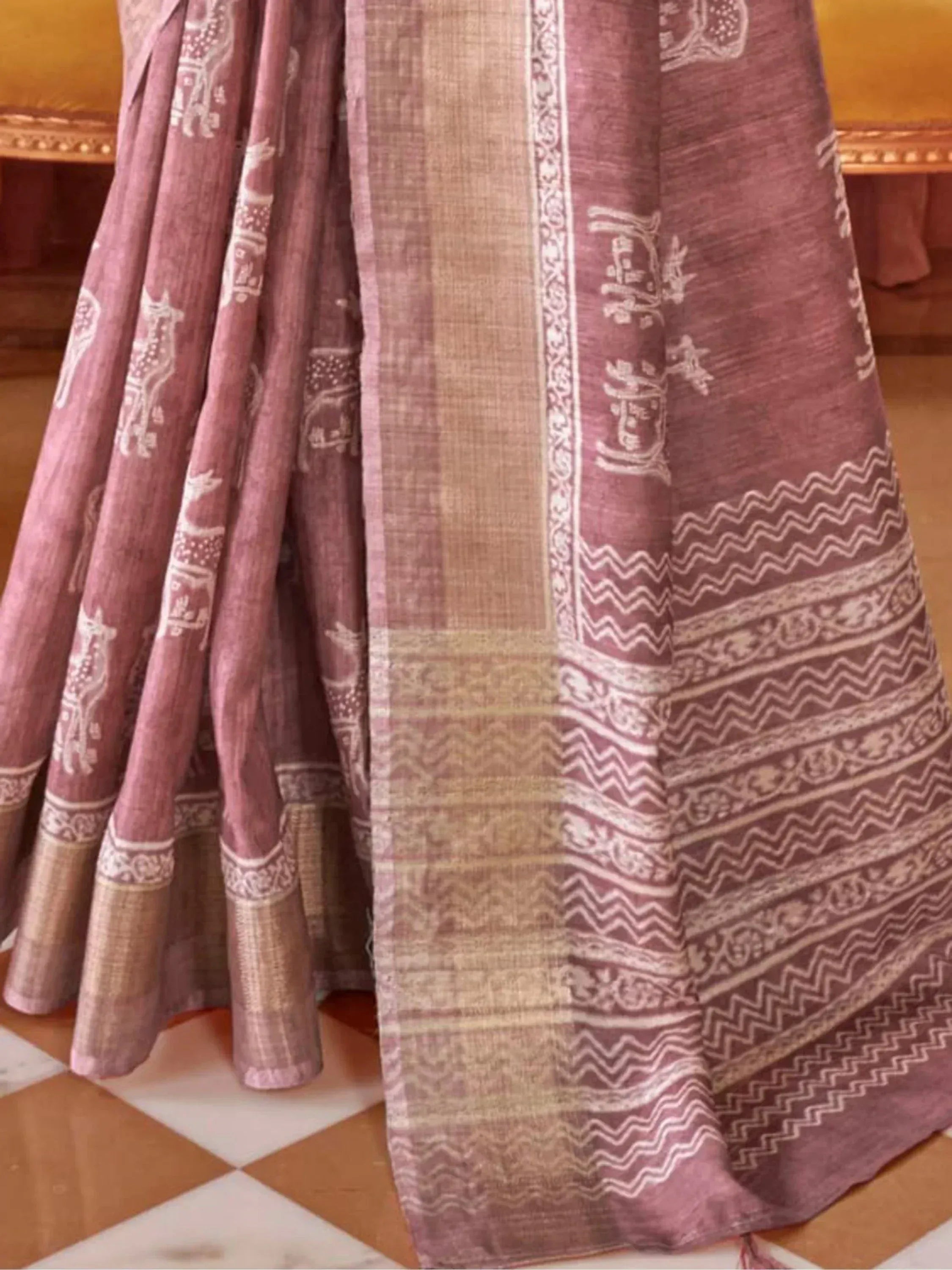 Dusty pink ethnic saree with white block print deer motifs and zigzag border, traditional Indian wear