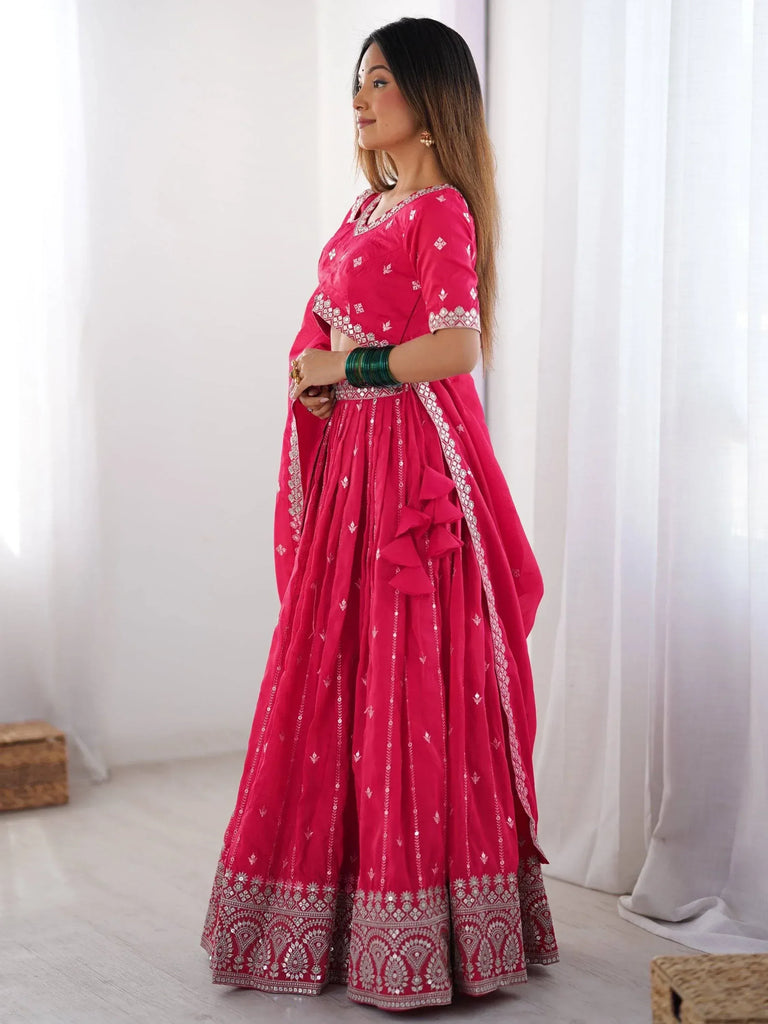 Pink embroidered lehenga choli with ruffle detailing, perfect for Indian ethnic wear occasions