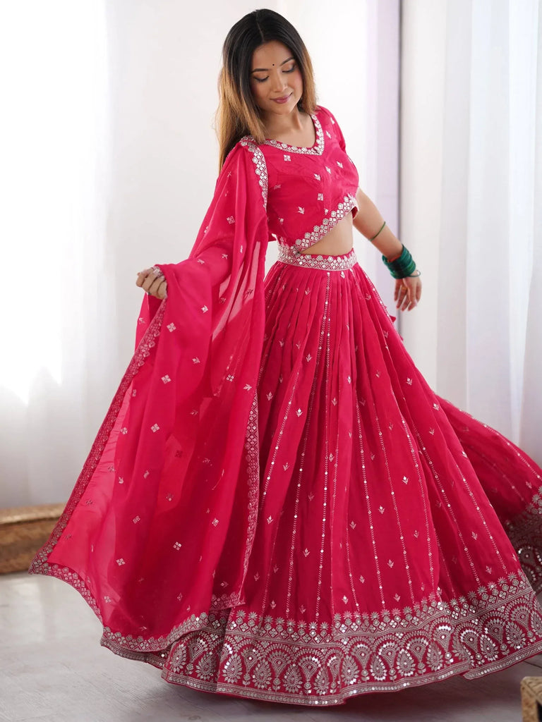 Pink designer lehenga choli with silver embroidery and mirror work, perfect for Indian ethnic occasions