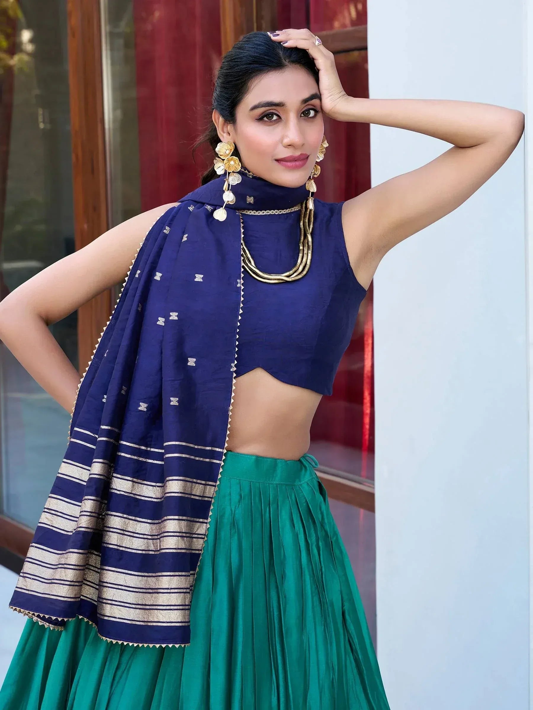 Navy blue crop top with green pleated skirt and gold trim dupatta, Indian ethnic wear