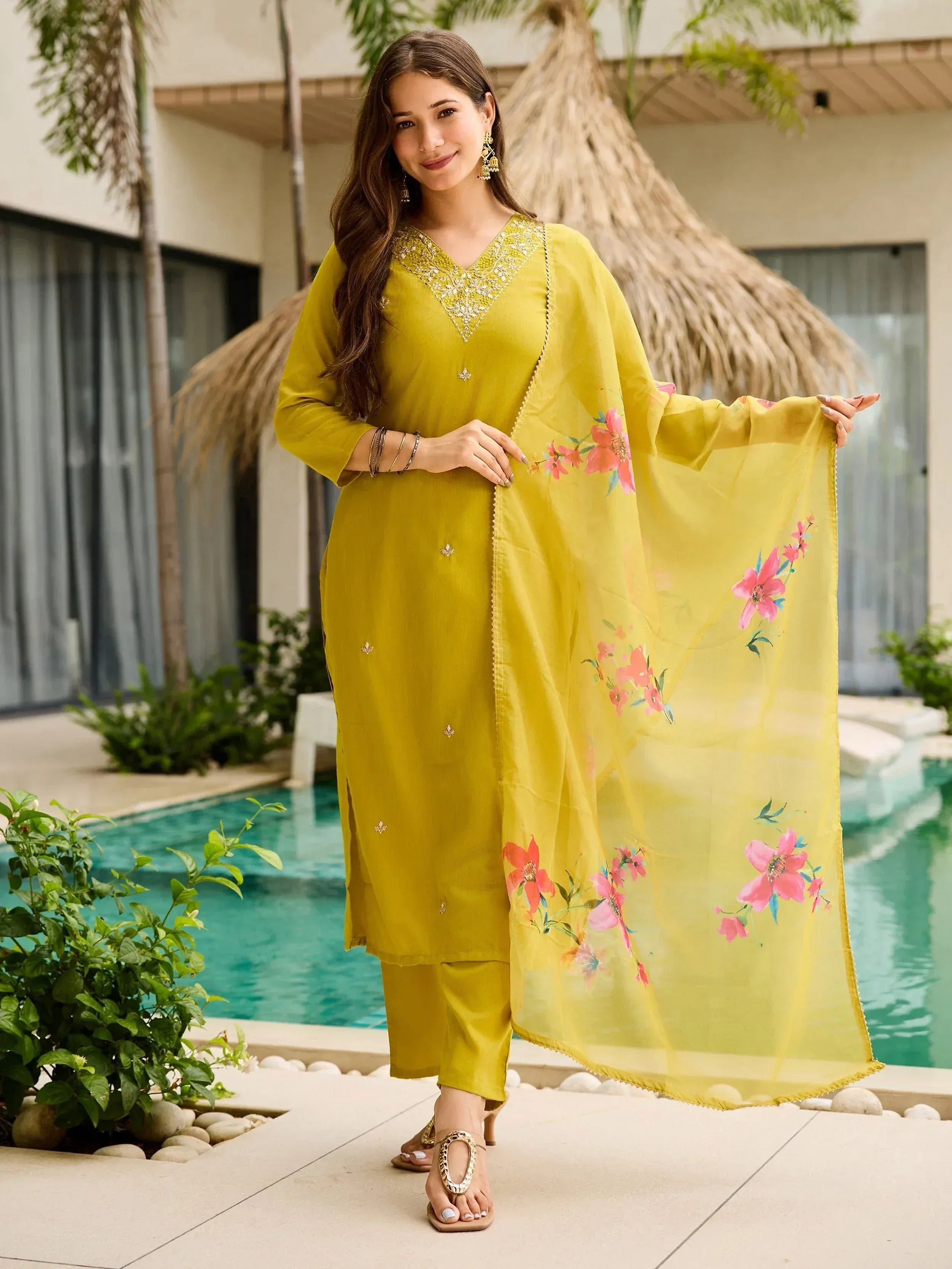 Yellow floral printed salwar kameez with embroidered neckline, perfect for ethnic wear occasions