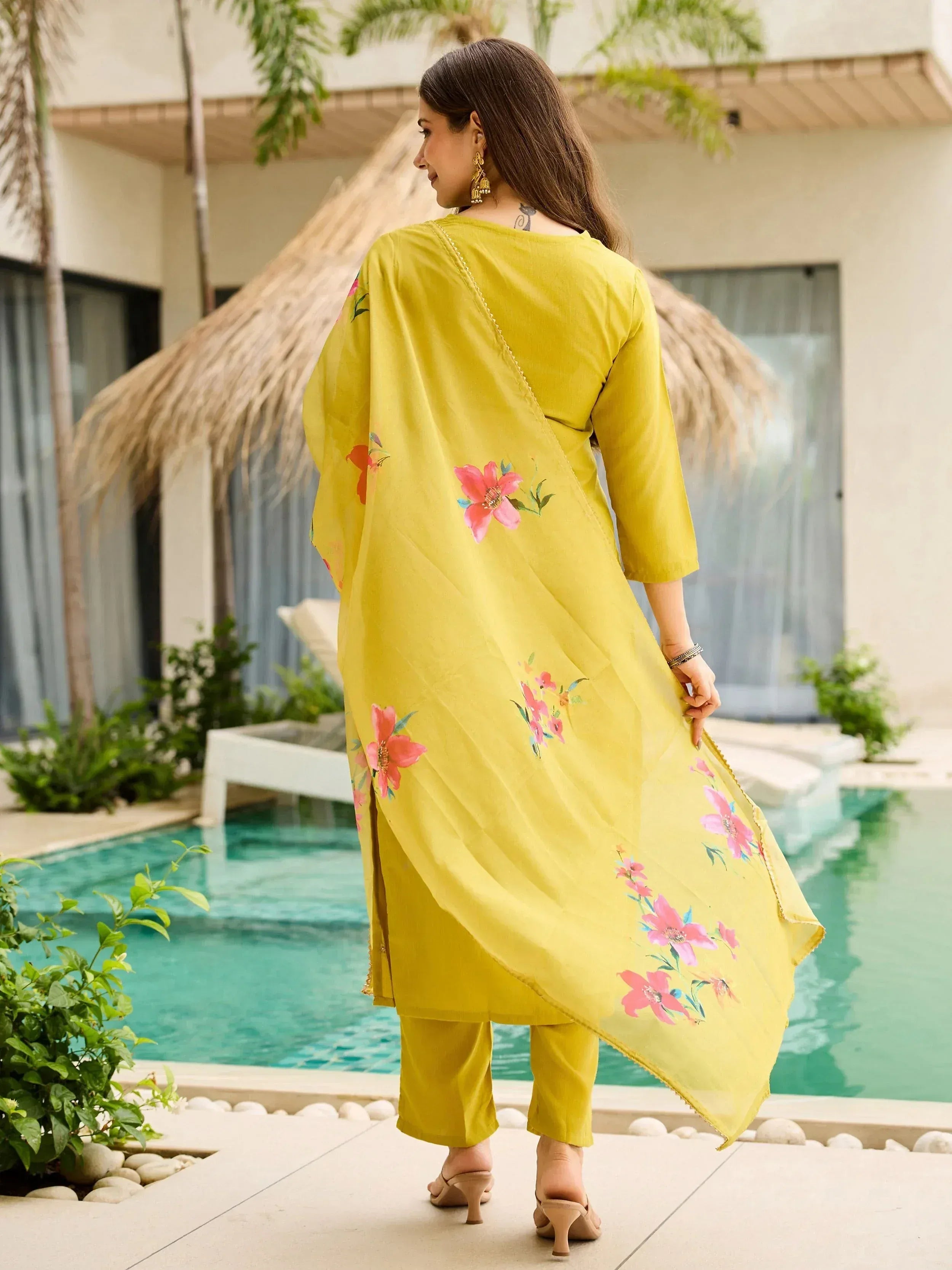 Yellow floral printed salwar kameez with dupatta, perfect for ethnic wear occasions near poolside
