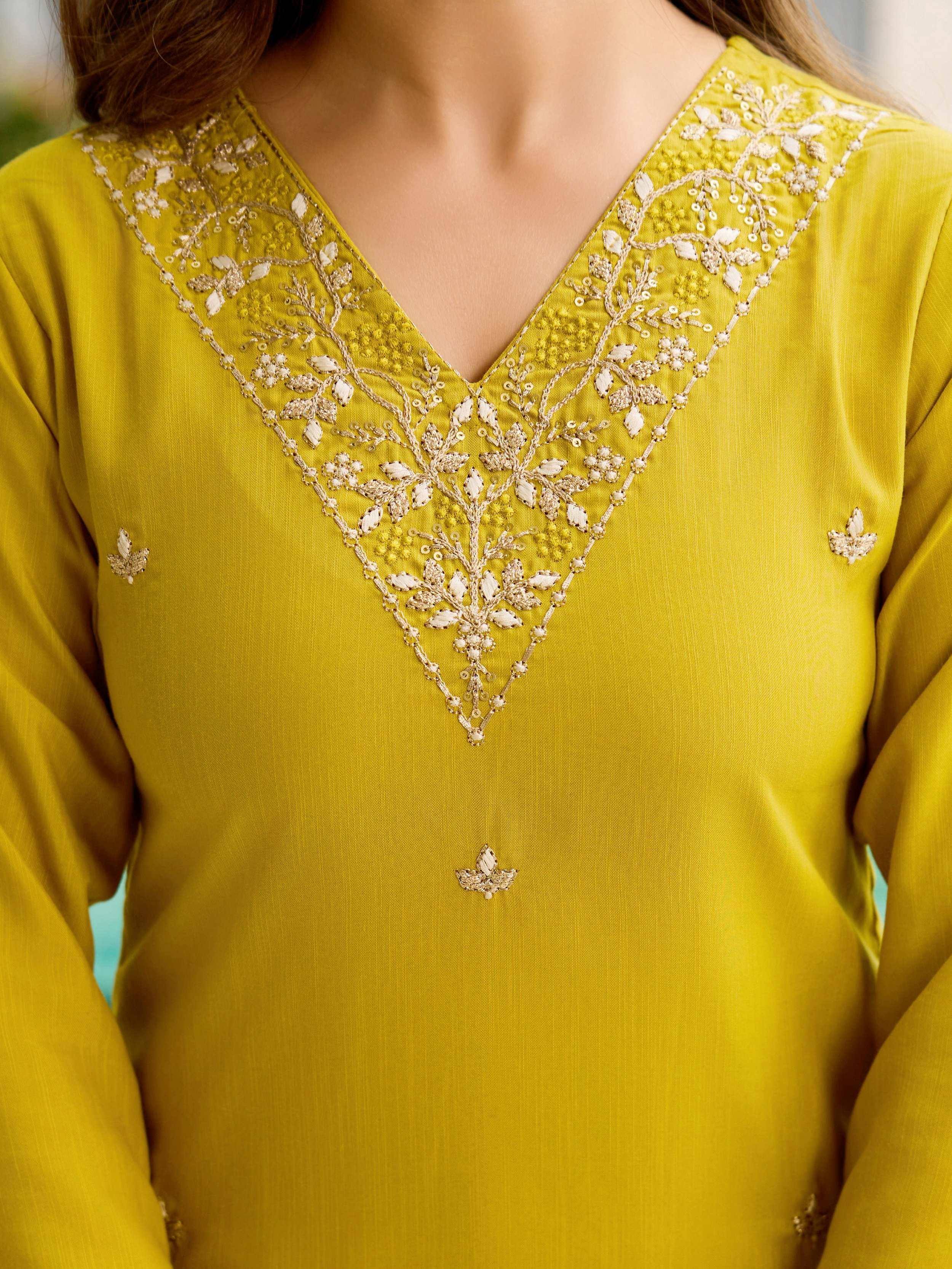 Yellow ethnic kurti with intricate floral embroidery and sequin detailing on V-neckline