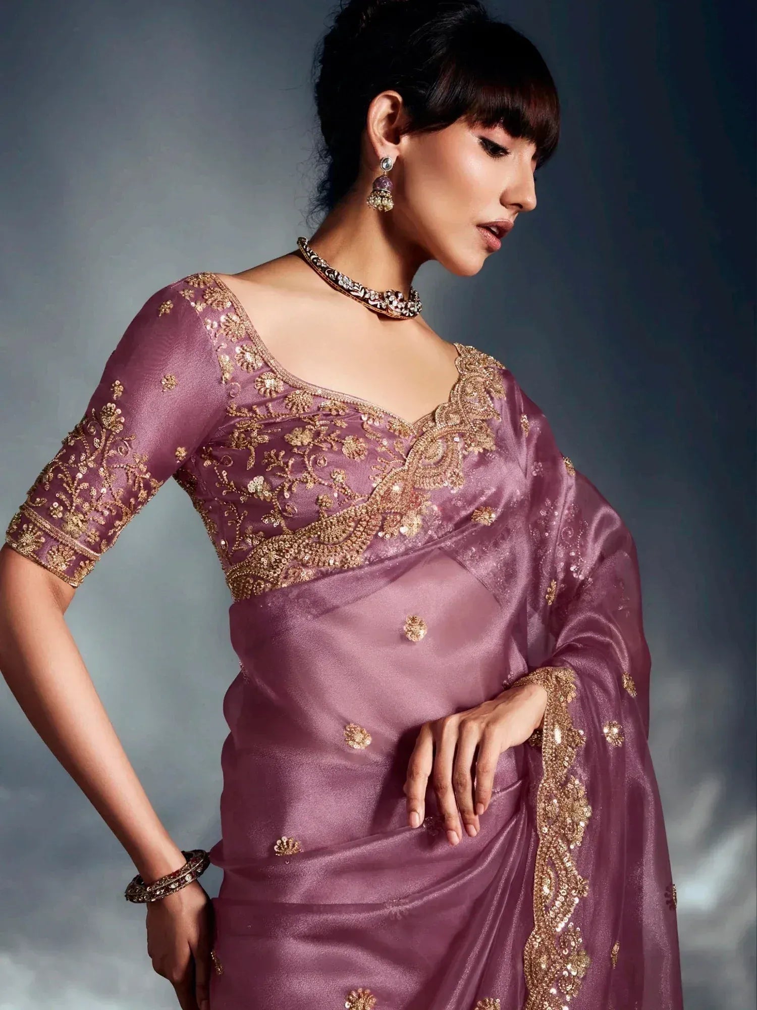 Elegant mauve saree with gold embroidery, perfect for Indian ethnic wear and festive occasions.