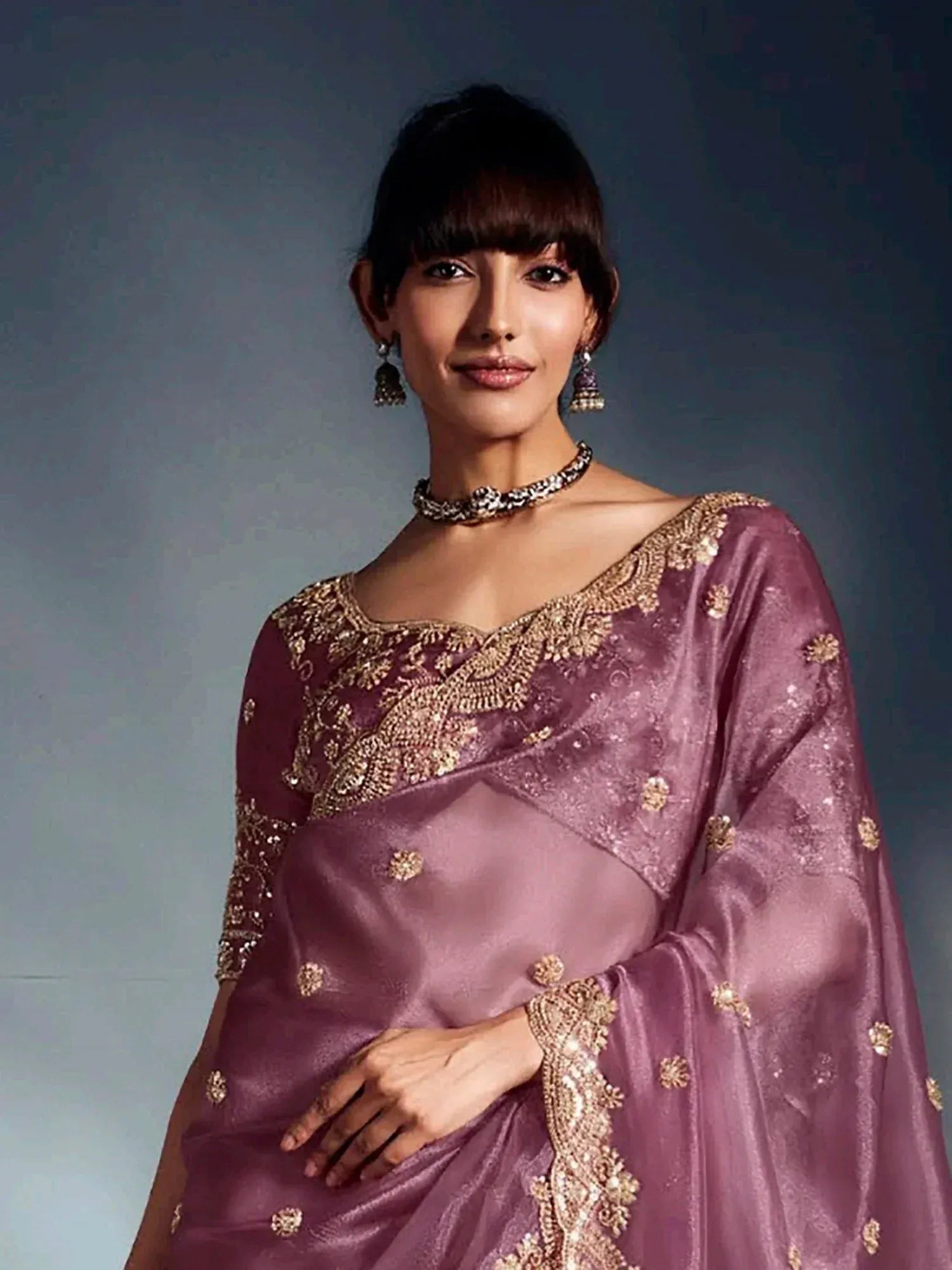Elegant mauve saree with gold embroidery, perfect for Indian ethnic wear occasions