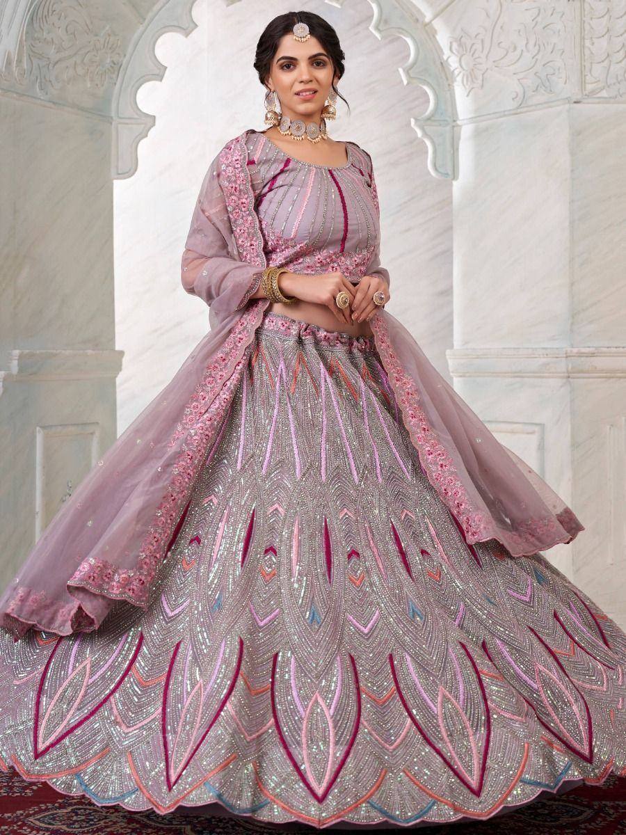 Elegant lavender lehenga choli with intricate embroidery and sequin work, perfect for Indian weddings and festive occasions.