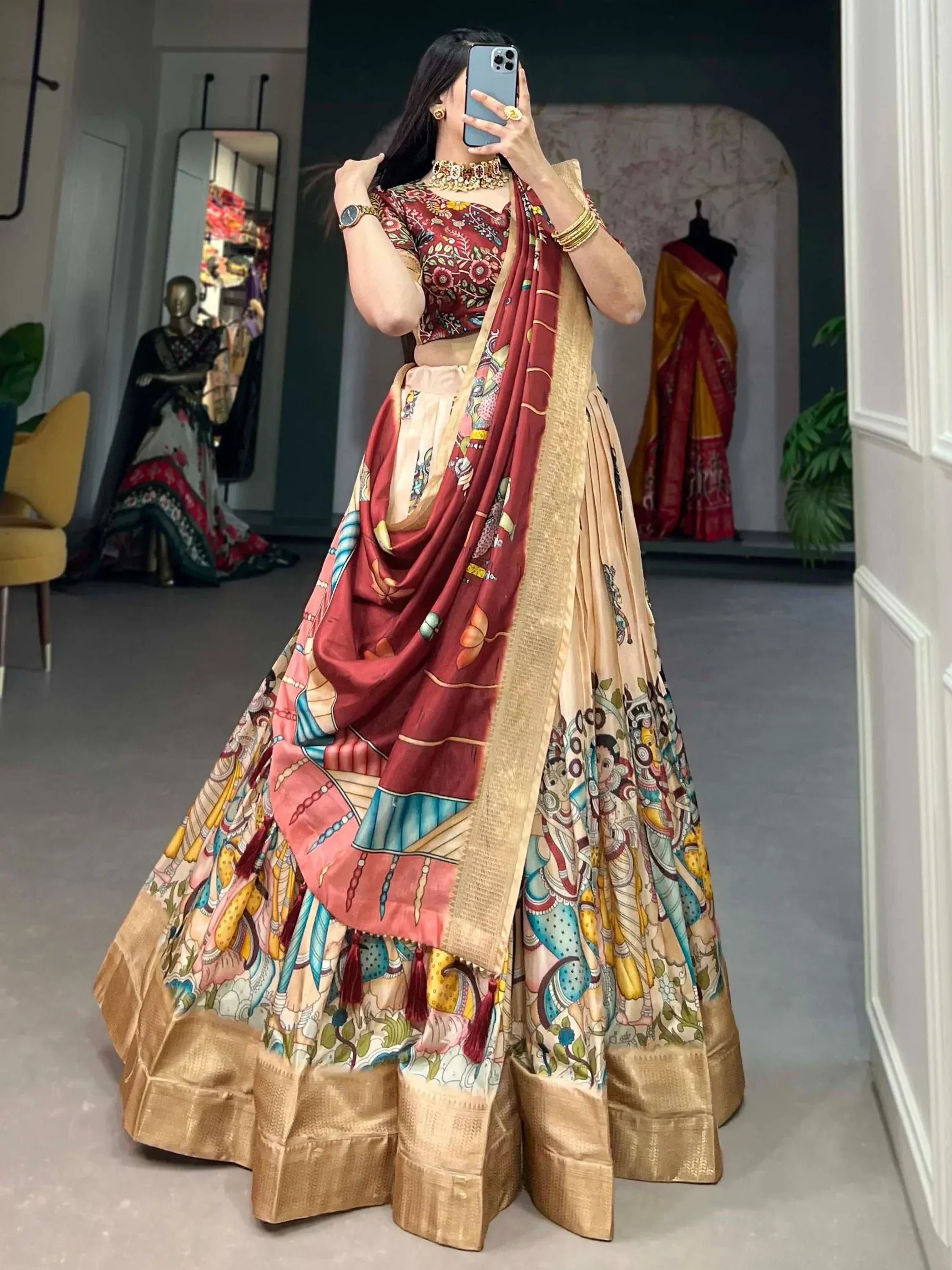 Woman in printed designer lehenga choli with gold border, ethnic wear for weddings and festivals