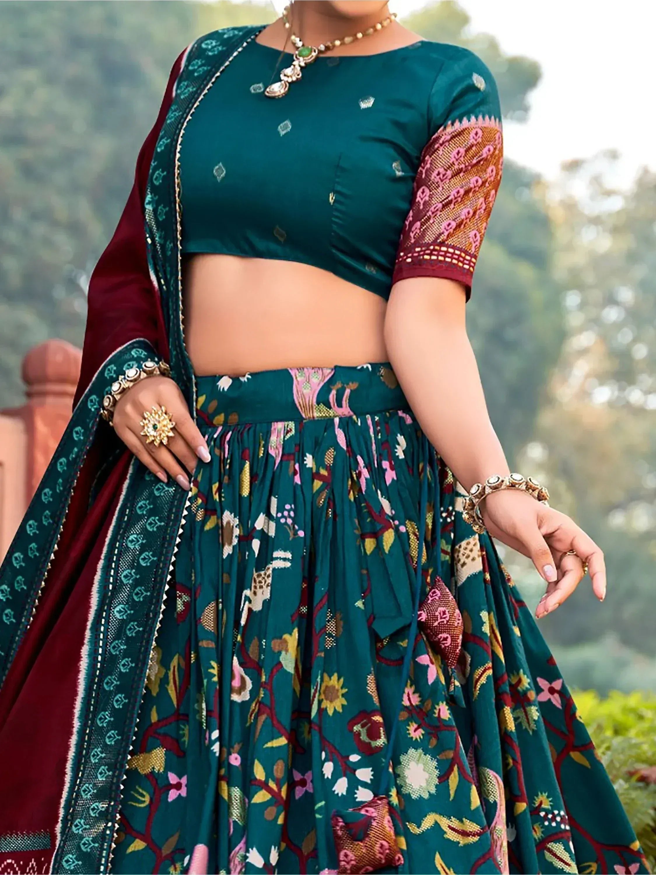 Teal floral lehenga choli with maroon dupatta, ethnic Indian wear for festive occasions