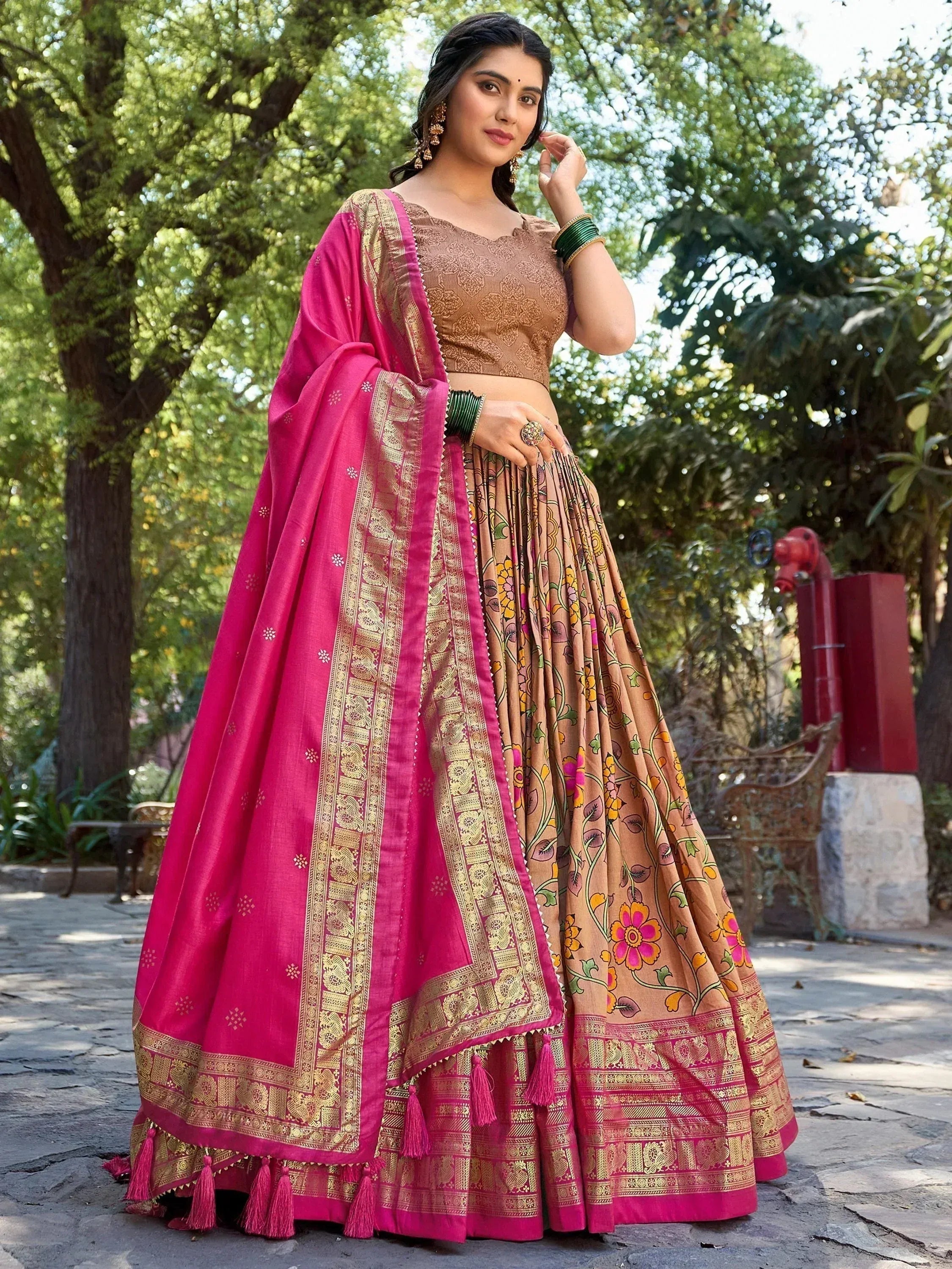 Pink and gold embroidered lehenga choli with floral print skirt, perfect for Indian ethnic wear occasions