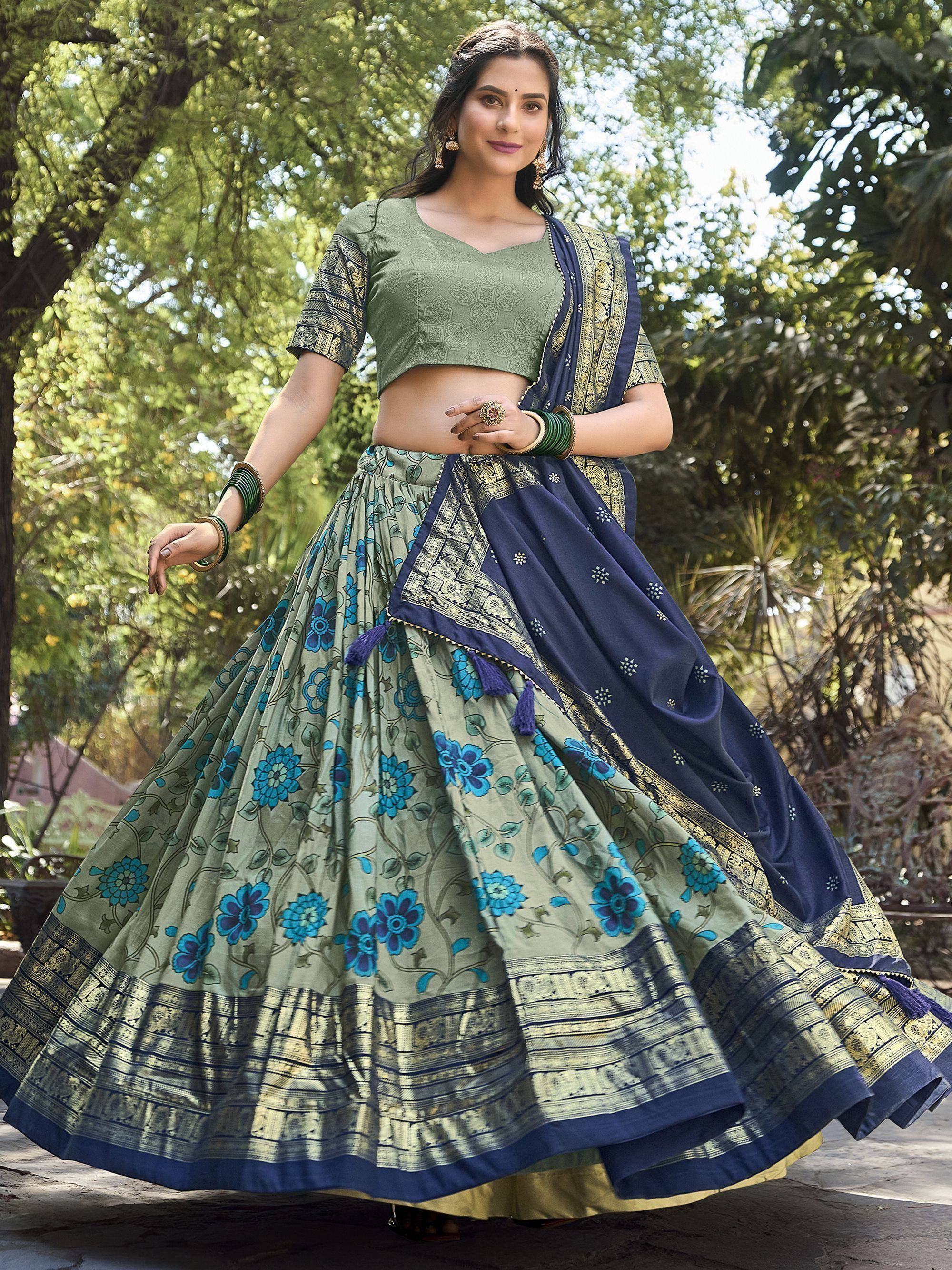 Green and blue floral lehenga choli with golden border, perfect for Indian ethnic wear occasions.
