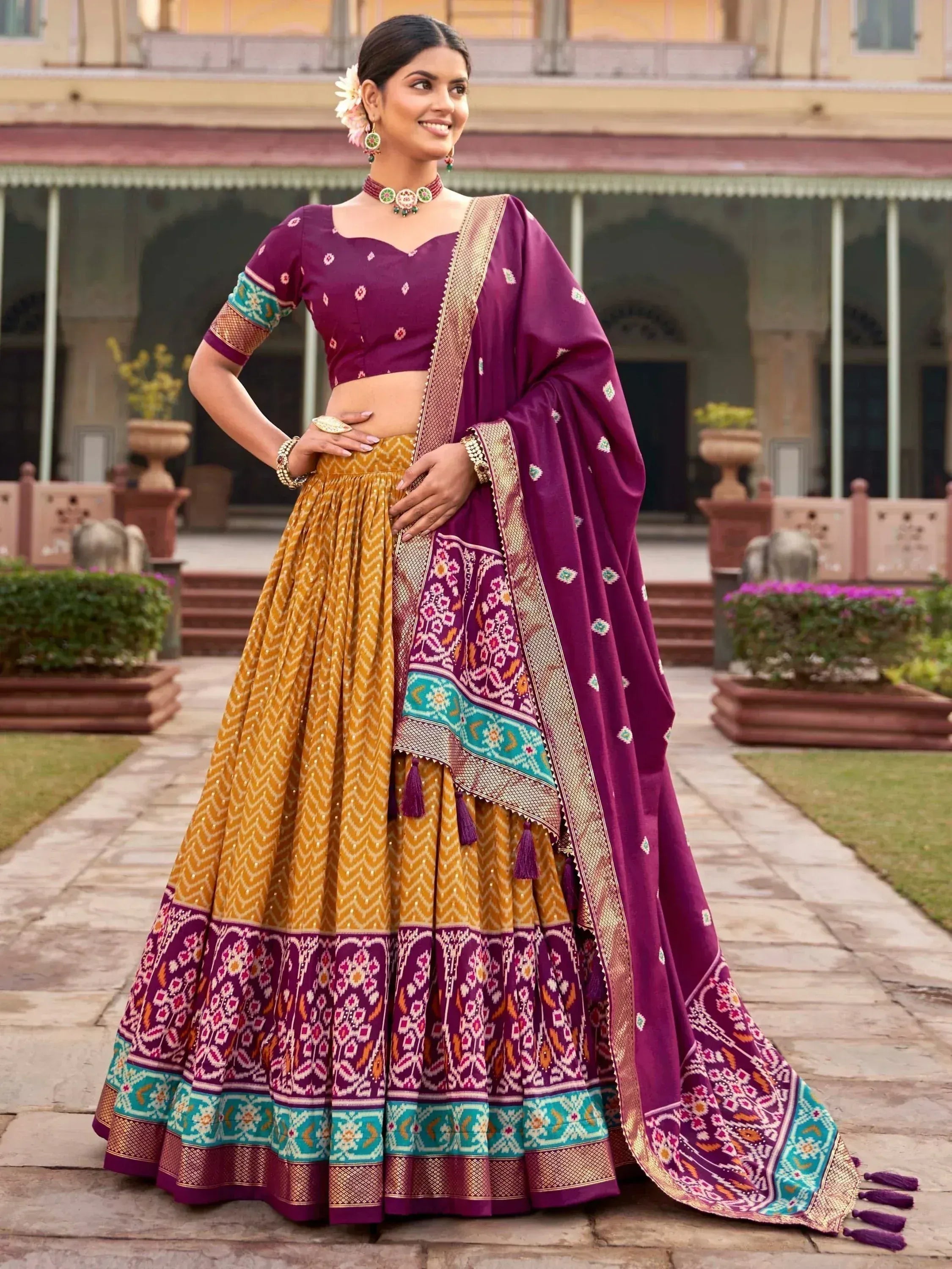 Purple and gold designer lehenga choli with intricate embroidery, perfect for Indian ethnic wear occasions.
