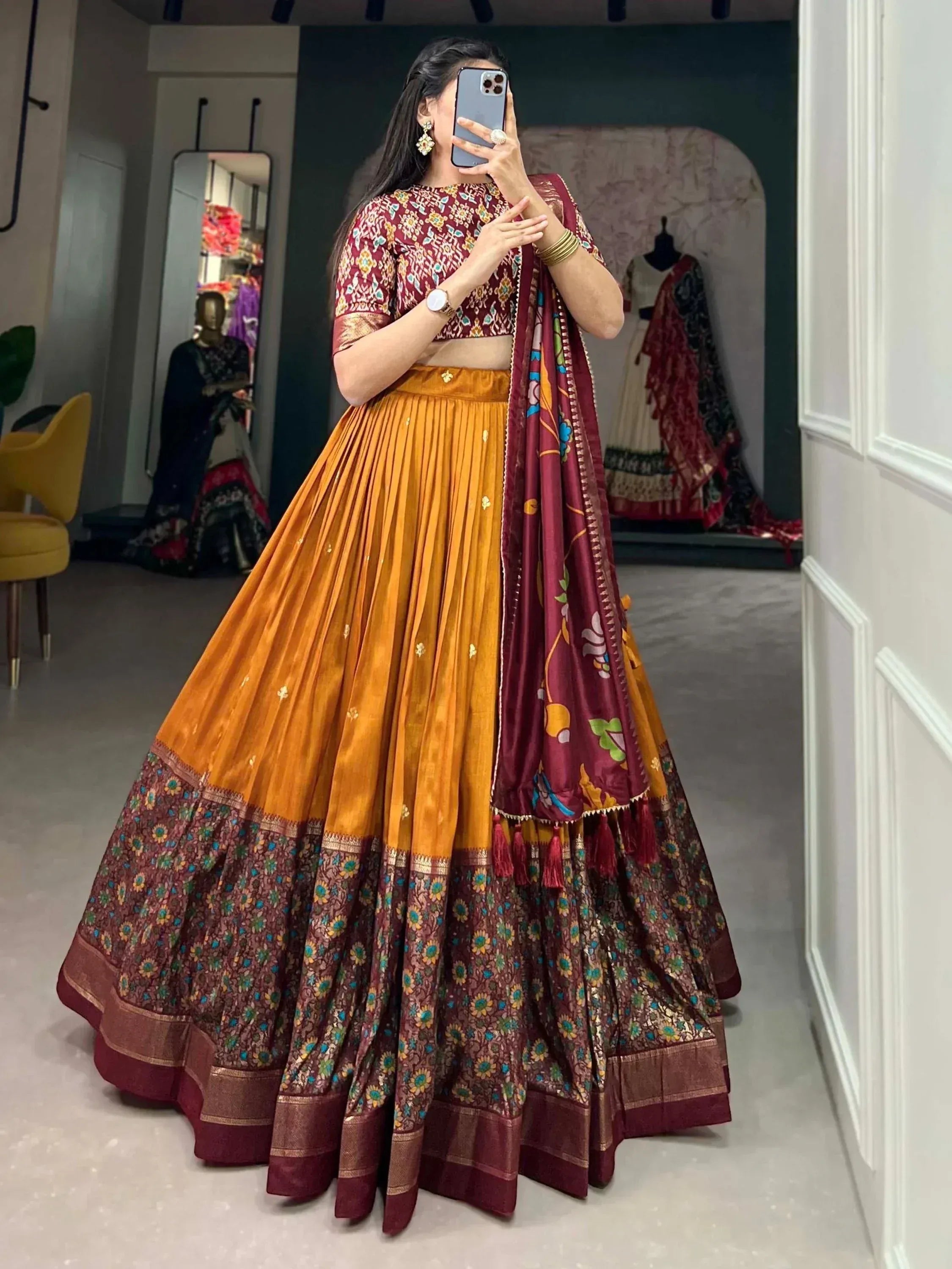 Maroon and mustard designer lehenga choli with floral print and pleated skirt, perfect for Indian ethnic wear
