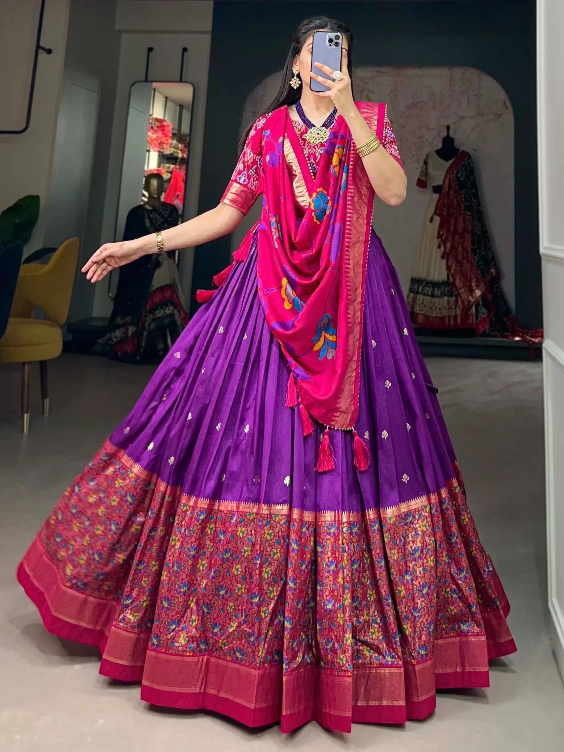 Vibrant purple and pink designer lehenga choli with floral dupatta, perfect for Indian ethnic occasions