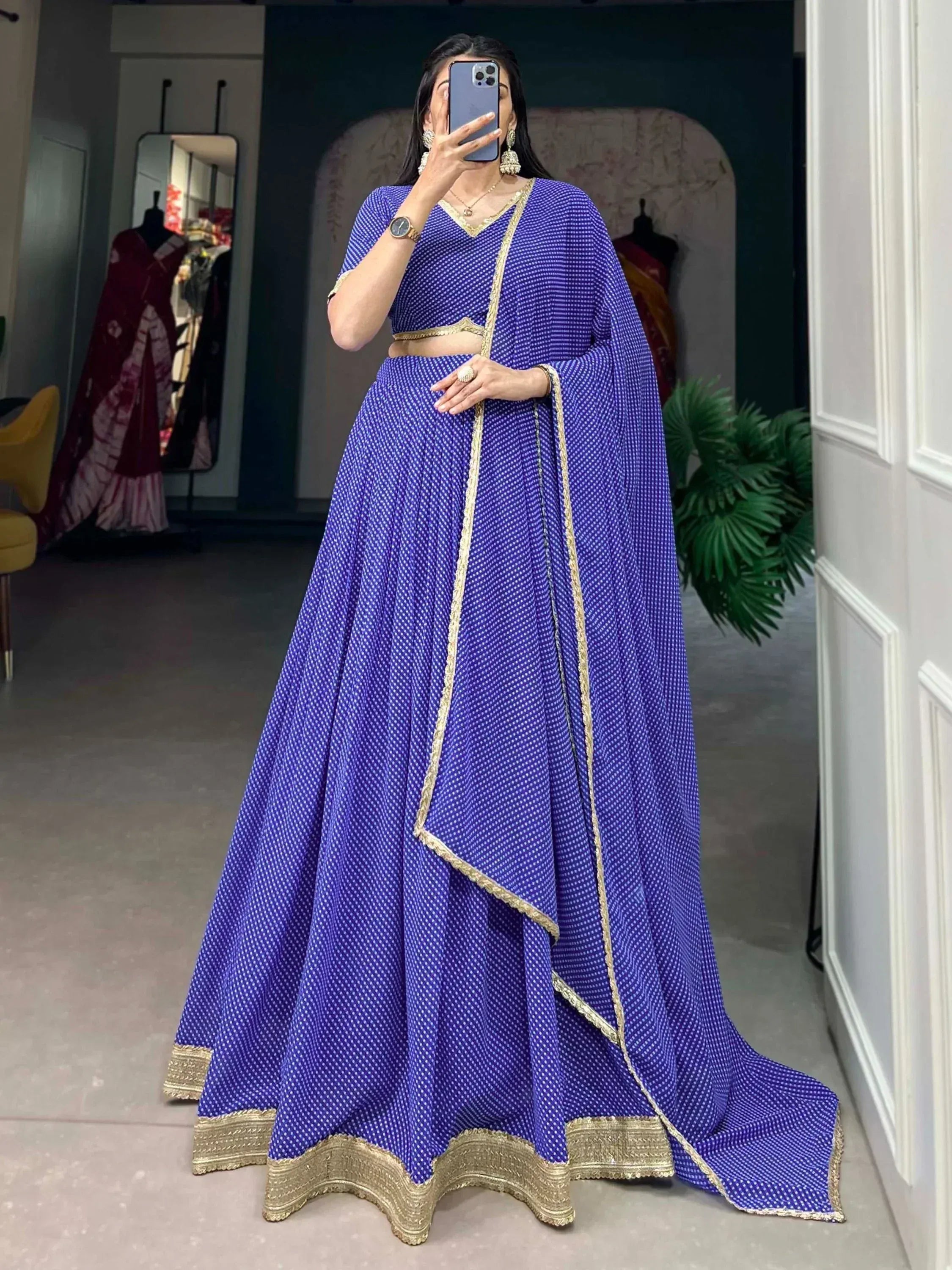 Royal blue ethnic lehenga choli with gold trim, perfect for Indian weddings and festive occasions