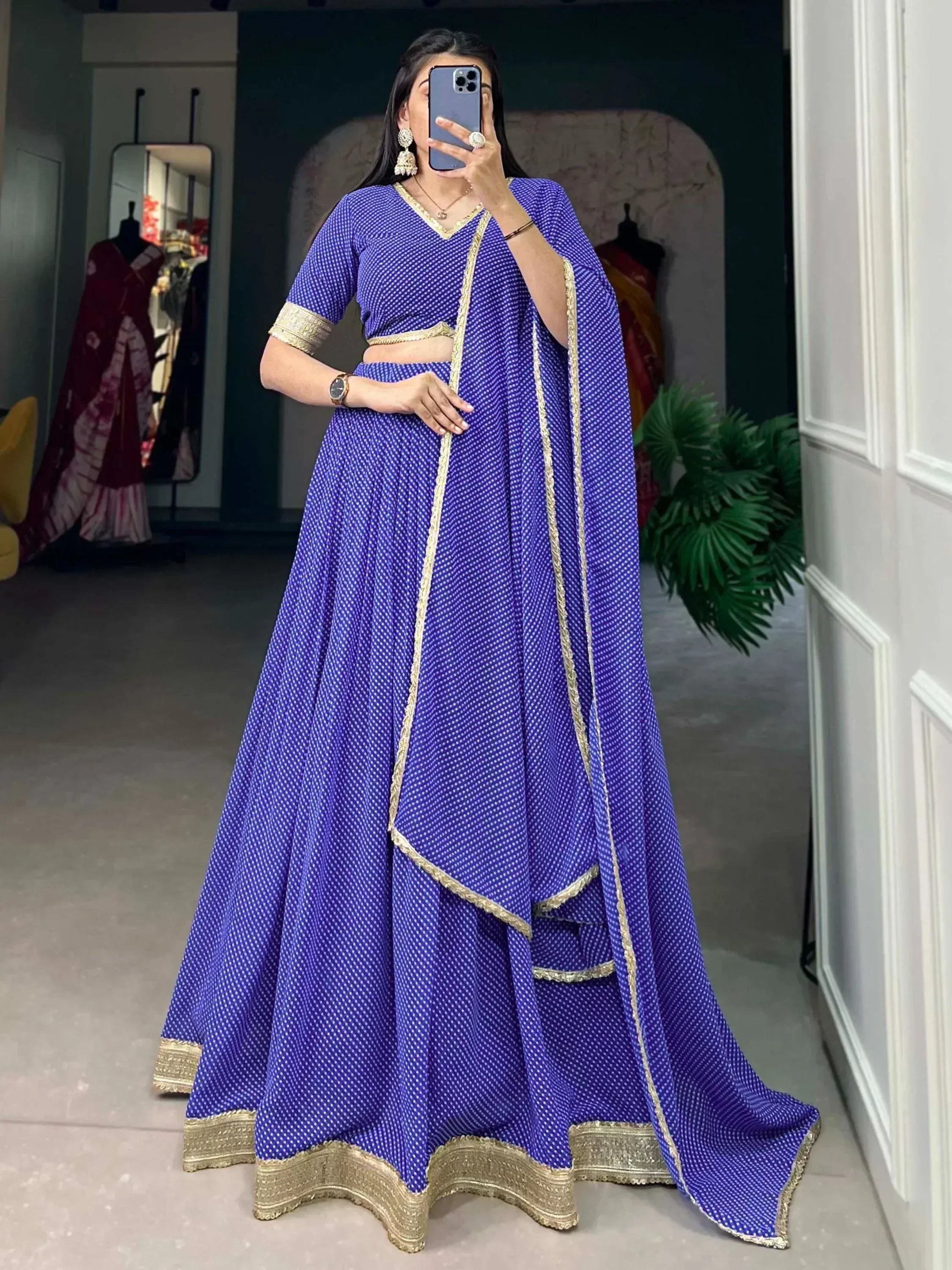 Royal blue printed lehenga choli with gold trim, perfect for Indian ethnic wear and festive occasions.