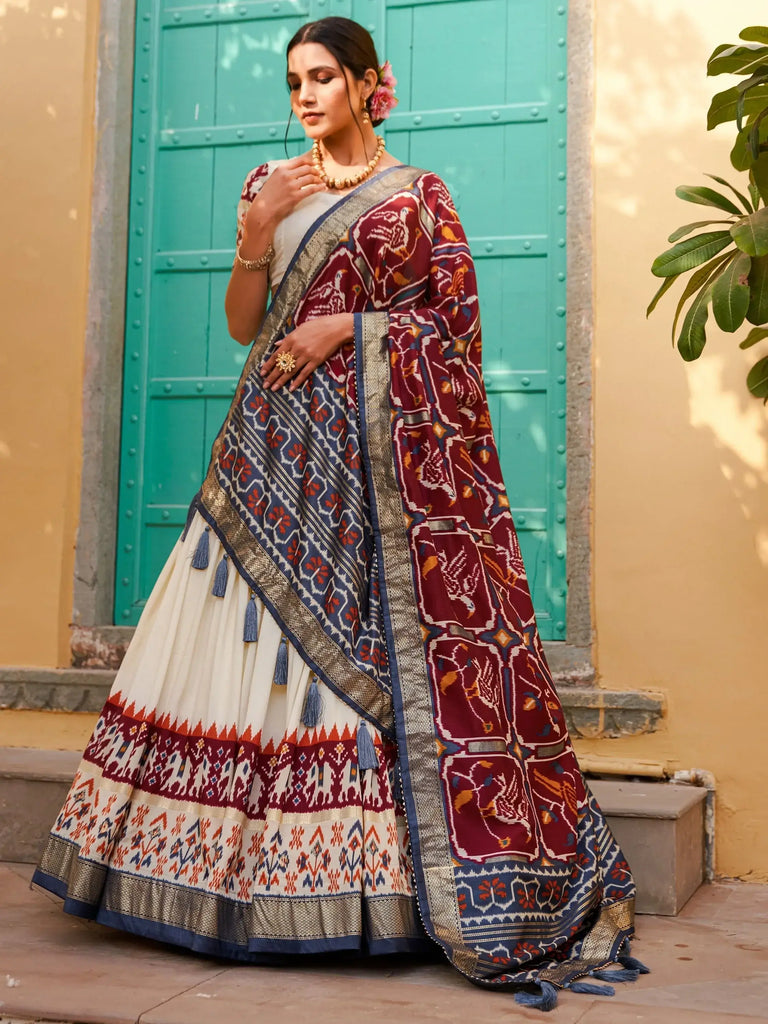 Magnetic White & Maroon Patola Printed Silk Navratri Wear Lehenga Choli