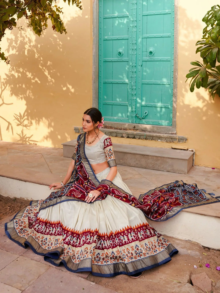 Magnetic White & Maroon Patola Printed Silk Navratri Wear Lehenga Choli