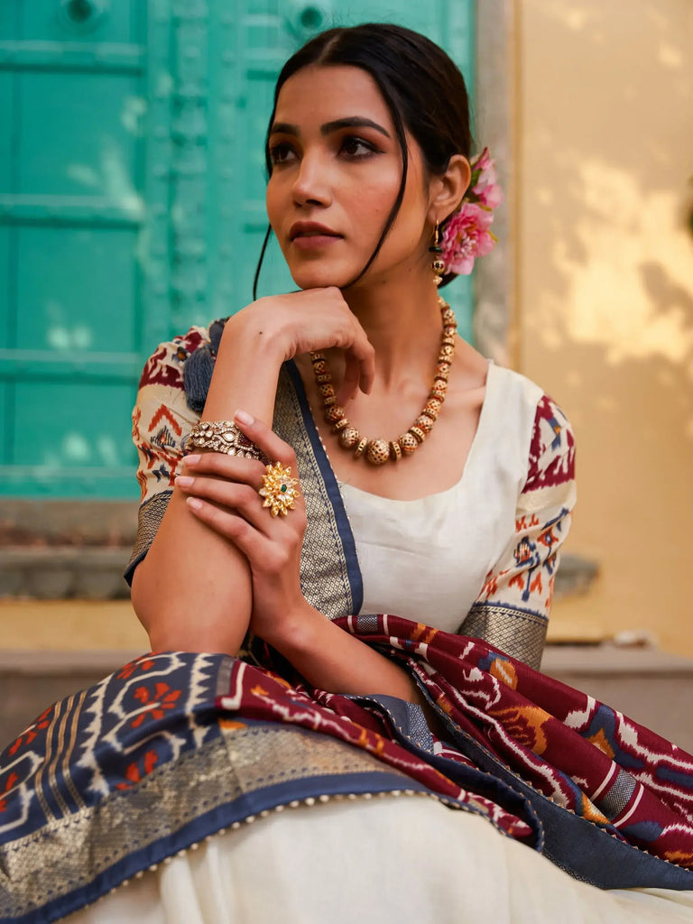 Magnetic White & Maroon Patola Printed Silk Navratri Wear Lehenga Choli