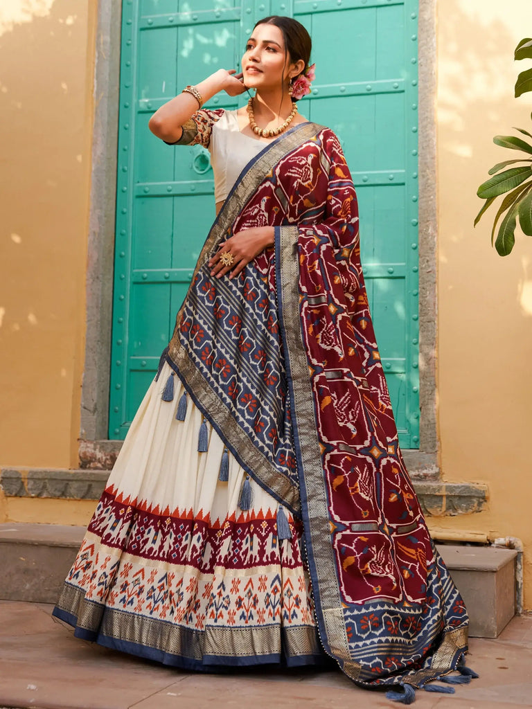 Magnetic White & Maroon Patola Printed Silk Navratri Wear Lehenga Choli