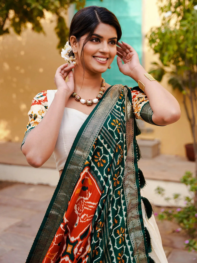 Charming White & Orange Patola Printed Silk Lehenga Choli With Dupatta