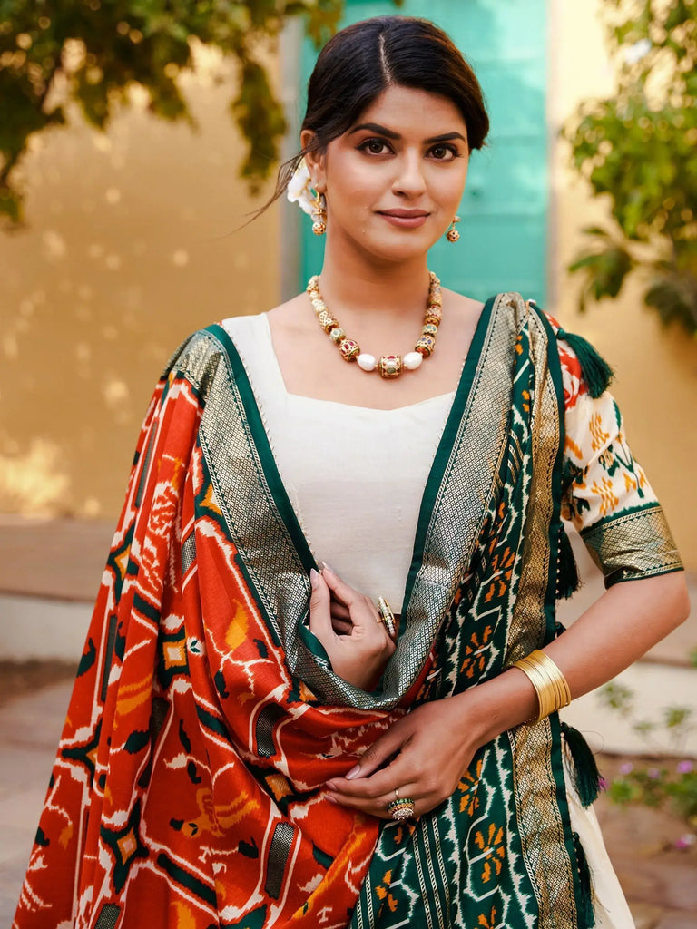Charming White & Orange Patola Printed Silk Lehenga Choli With Dupatta