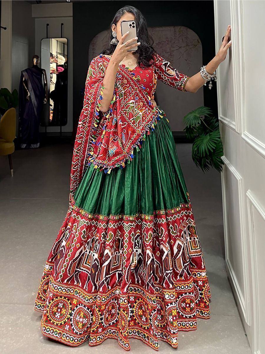 Red and green embroidered lehenga choli with mirror work, perfect for Indian ethnic wear occasions