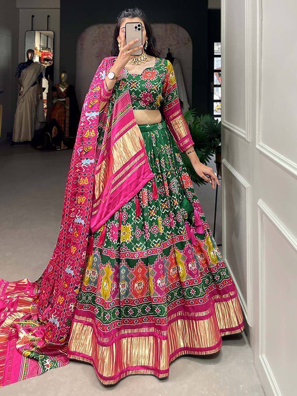 Vibrant green and pink printed lehenga choli with dupatta, perfect for Indian ethnic occasions