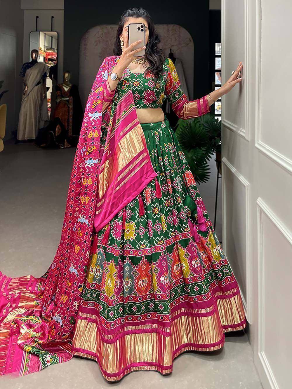 Vibrant green and pink printed lehenga choli with dupatta, ethnic Indian wear for festive occasions
