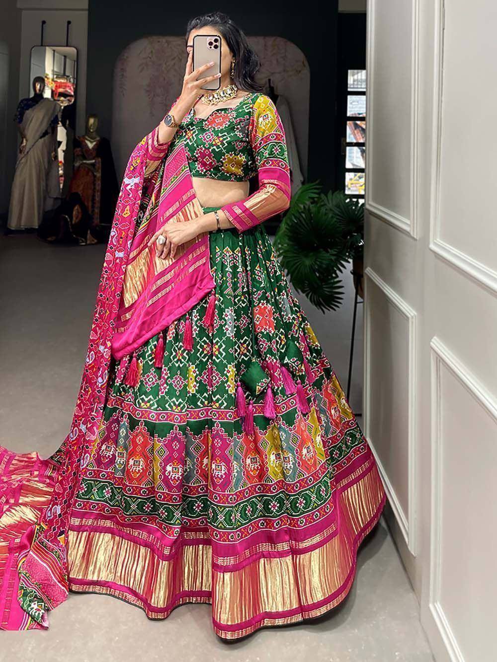 Vibrant green and pink printed lehenga choli with dupatta, perfect for Indian ethnic occasions