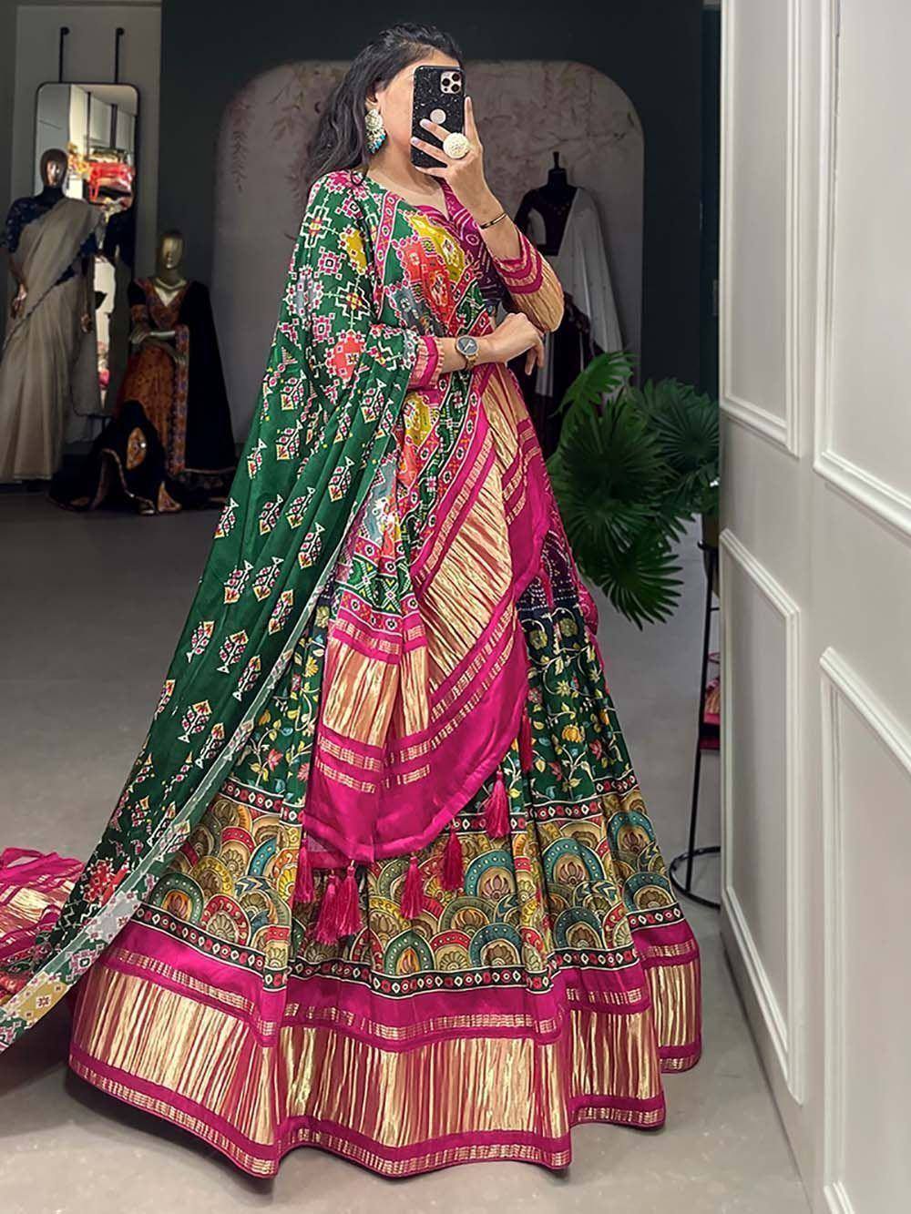 Vibrant Indian lehenga choli with green dupatta, floral prints, and pink gold borders for festive occasions