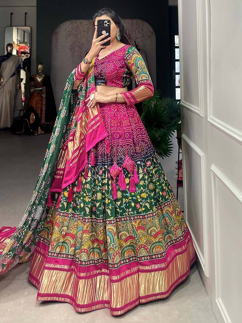 Vibrant pink and green designer lehenga choli with floral embroidery and tassels, perfect for Indian ethnic wear