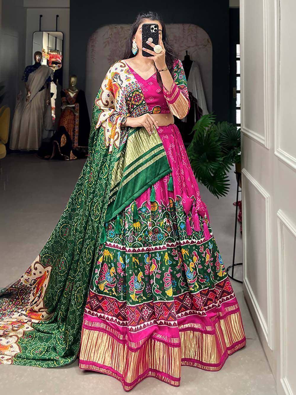Vibrant pink and green printed lehenga choli with embroidered dupatta, perfect for Indian ethnic occasions