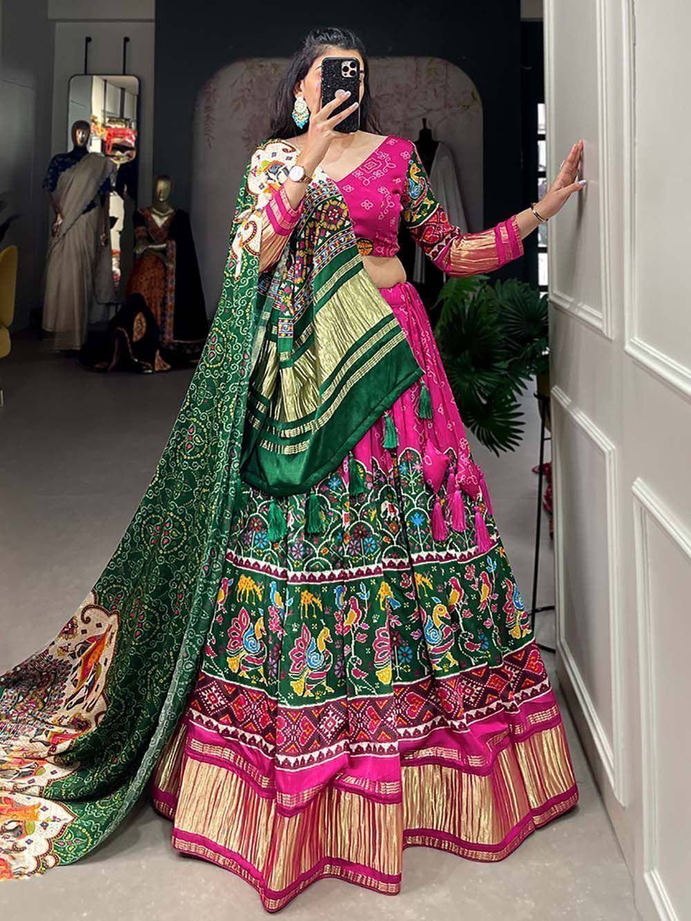 Vibrant pink and green embroidered lehenga choli with dupatta, perfect for Indian ethnic occasions