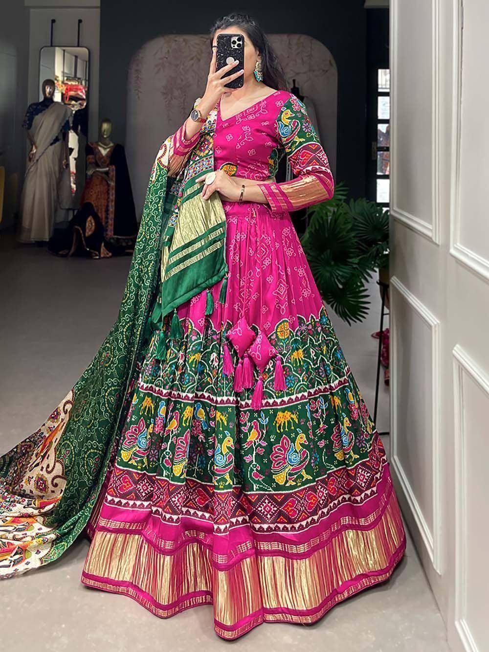 Vibrant pink and green printed lehenga choli with peacock motifs, perfect for Indian ethnic wear occasions.