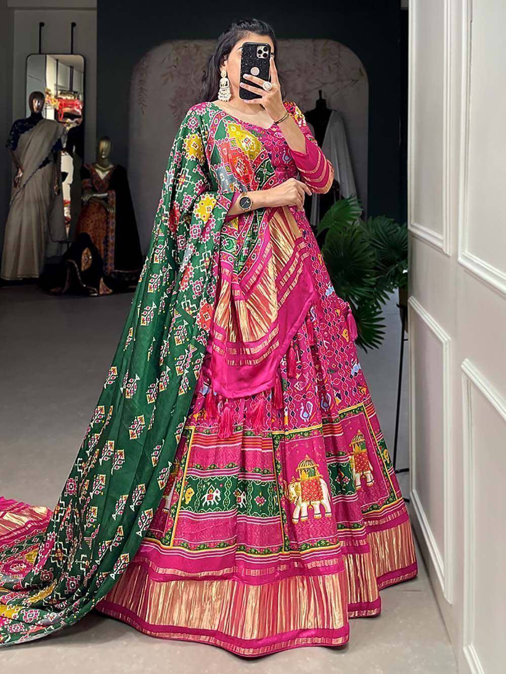 Vibrant pink and green printed lehenga choli with elephant motifs, perfect for Indian ethnic occasions