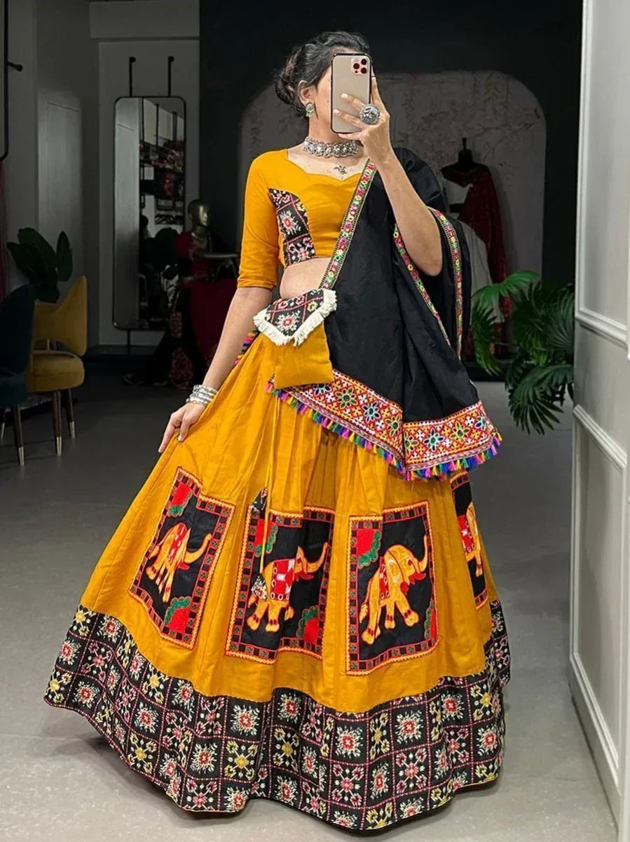 Yellow and black embroidered lehenga choli with elephant motifs, perfect for Indian ethnic wear occasions